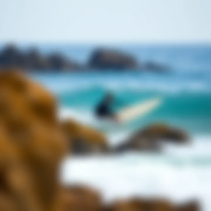 Surfer Navigating Safely Away from Rocks Surfer navigating safely away from rocks