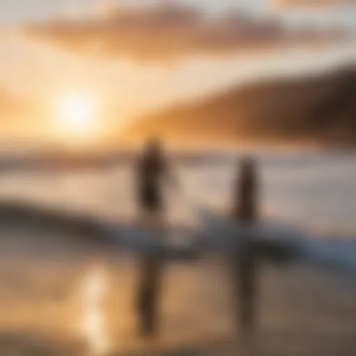 Couple surfing together at sunset