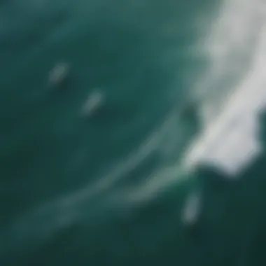 An aerial view of surfers riding the waves