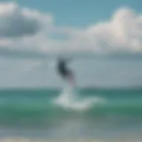 A kite surfer gliding over the turquoise waters of the Outer Banks with a dynamic skyline in the background