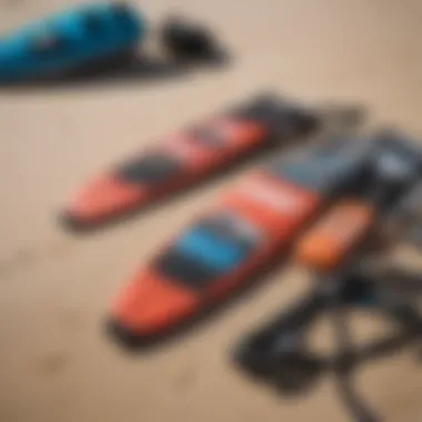 Close-up of essential kite surfing gear laid out on the beach, highlighting the equipment used