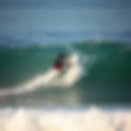 A surfer executing the hang ten maneuver on a wave