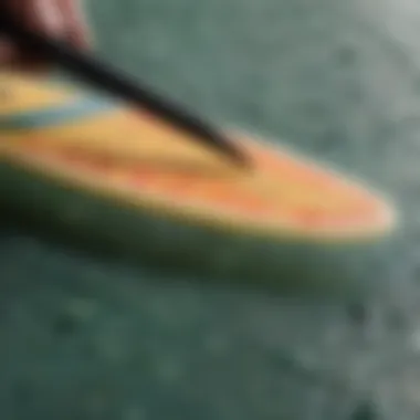 Understanding Surfboard Wax Scrapers Close-up of a surfboard wax scraper with textured surface