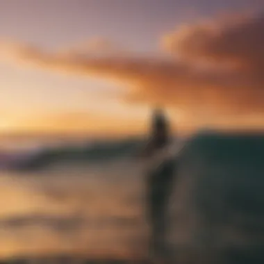 Surfer silhouetted against a vibrant sunset over the ocean