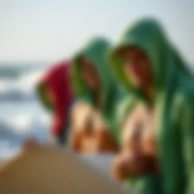 Group of surfers wearing towel hoodies after surfing session
