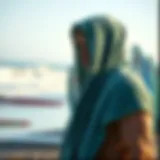 Towel hoodie on a beach with surfboards in the background