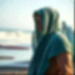 Towel hoodie on a beach with surfboards in the background