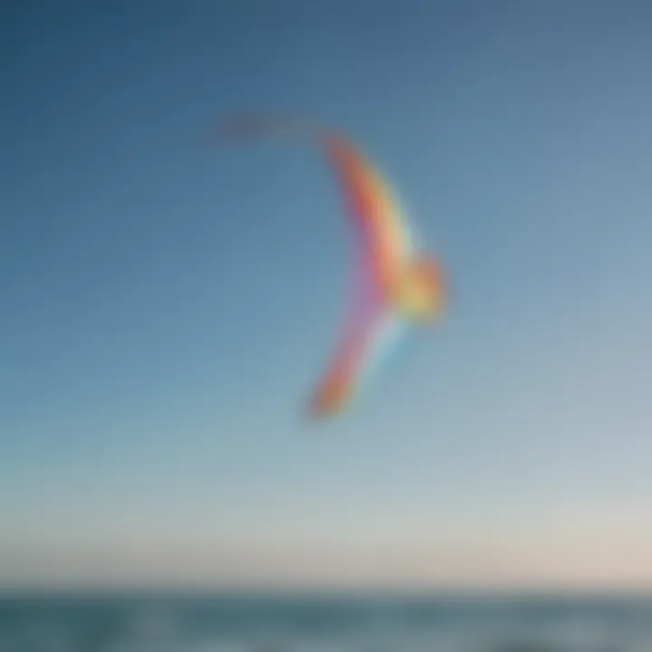 A vibrant training kite soaring high against a clear blue sky