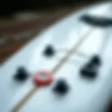 Detailed view of a surfboard deck showing various components