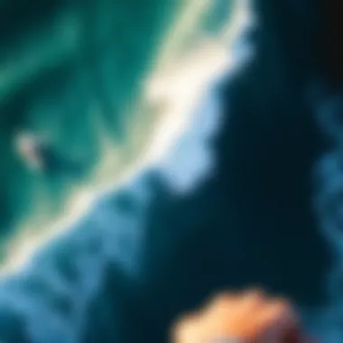 Dynamic Surfing Action at Tourmaline Aerial view of surfers riding waves at Tourmaline Surfline, highlighting the dynamic interaction with the ocean.