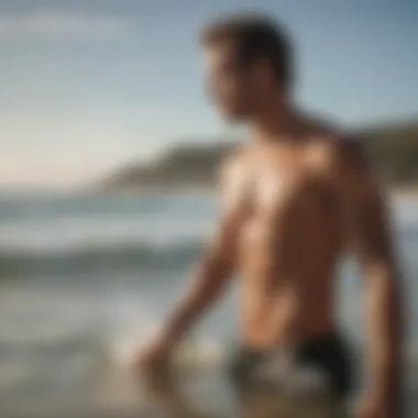 A surfer applying sunscreen before hitting the waves