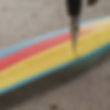 Close-up of a durometer measuring the hardness of surfboard material.