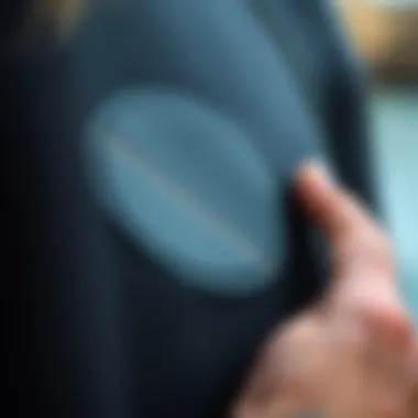 Close-up of neoprene wetsuit patch application