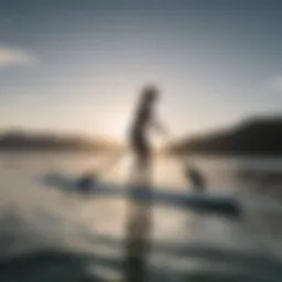 A sleek self-propelled stand up paddle board gliding over calm waters