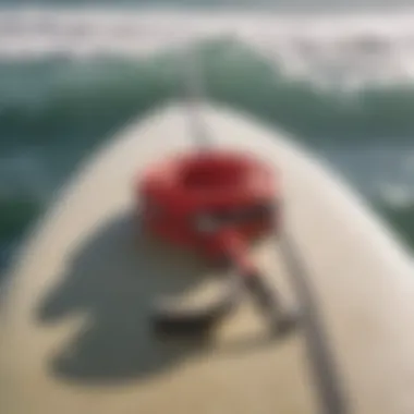 Surf Leash Attachment on Board Detail of a surf leash attached to a surfboard