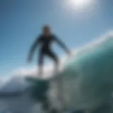 A surfer rides a wave under a clear blue sky with wind direction indicators.