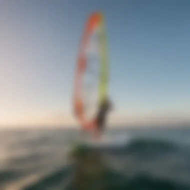 A beginner's first venture into windsurfing Beginner windsurfer learning on calm waters