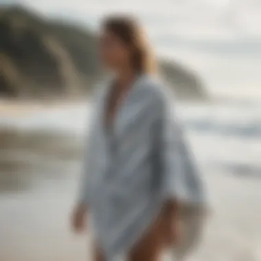 Fashionable individual wearing a surf poncho towel after a surf session